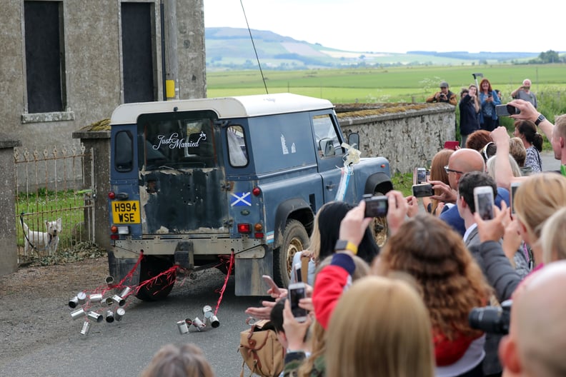 Well-wishers, fans, and paparazzi waited outside the church.