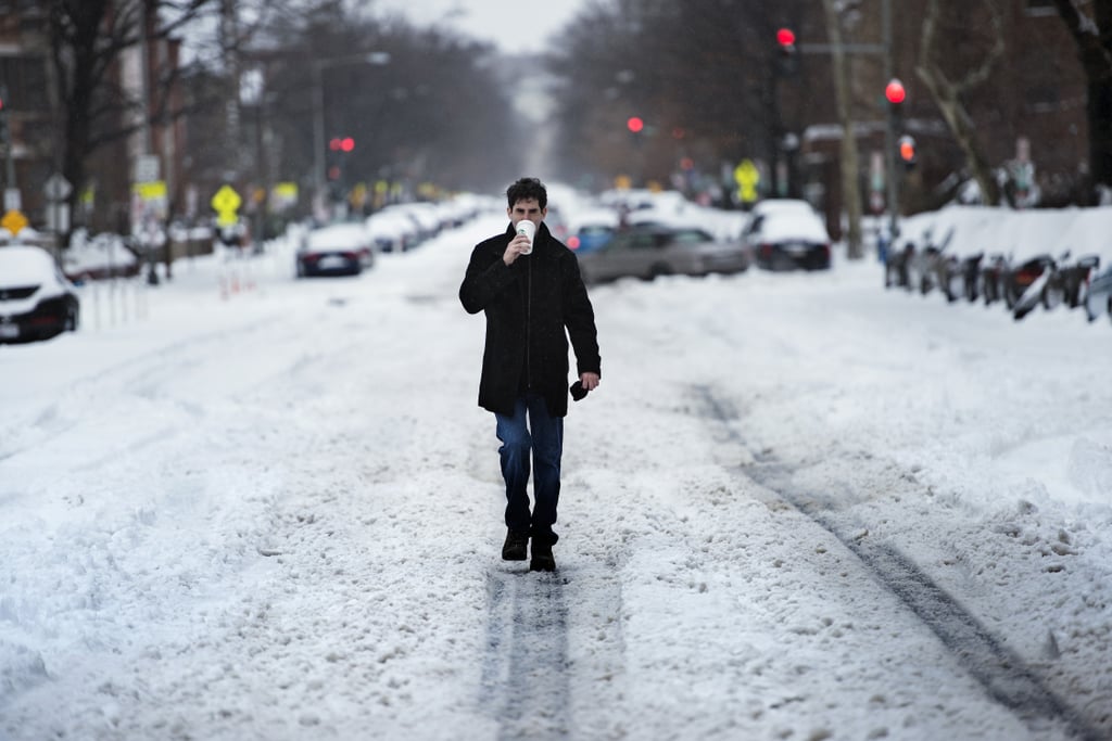 One man made his way down the center of a Washington DC road, coffee in hand.