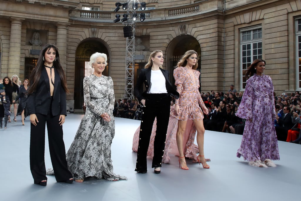 Camila posing alongside (from right to left) Helen Mirren, Amber Heard, Doutzen Kroes, and Liya Kebede.