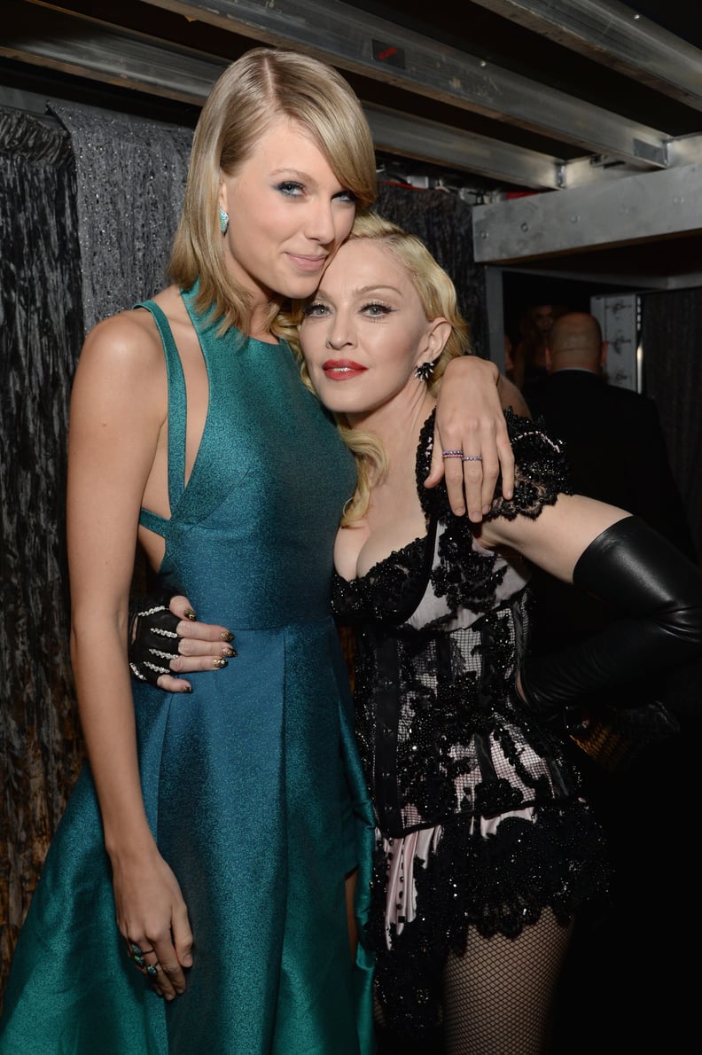 Taylor Swift towered over her.