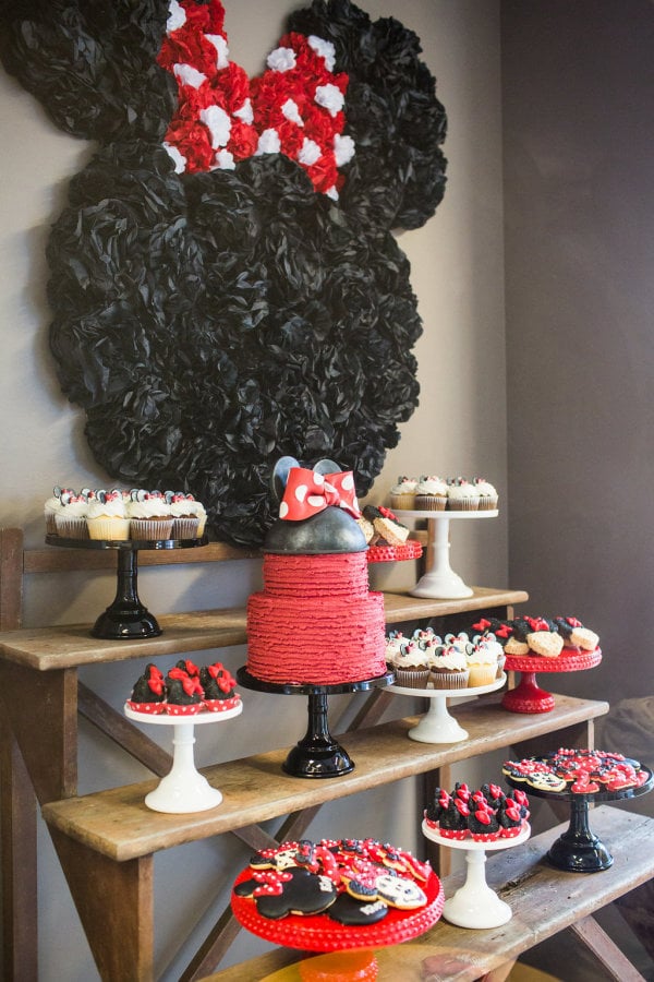 The dessert table was a sight to see! Tissue pom-poms were used to create a huge Minnie Mouse silhouette.
