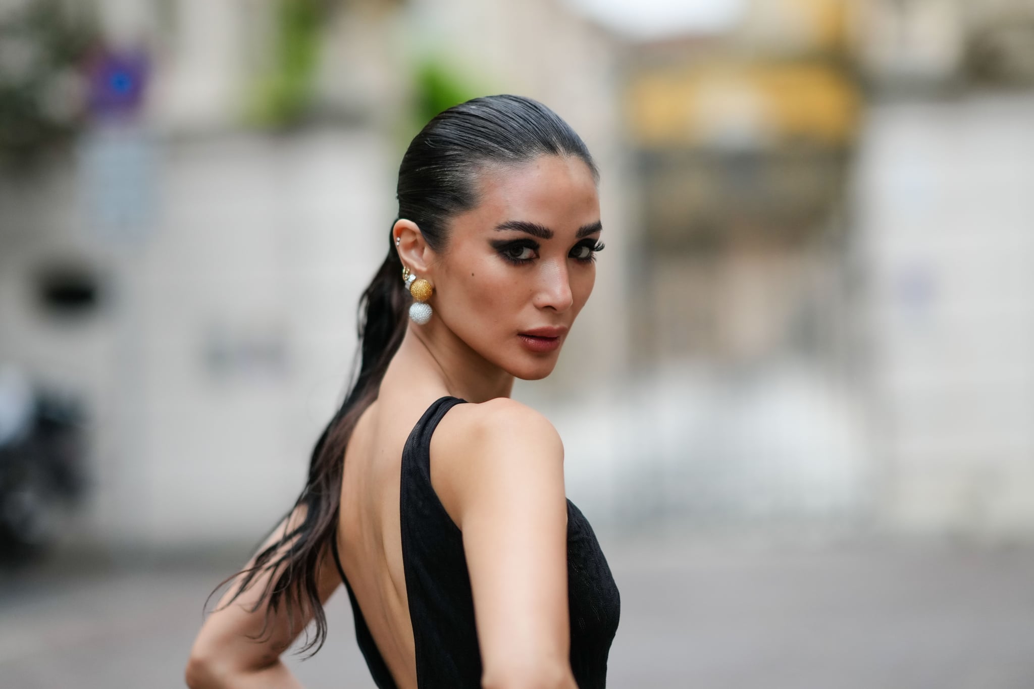 MILAN, ITALY - SEPTEMBER 20: Heart Evangelista wears a sleeveless black long mesh bodysuit with fluffy pants and floral embroidery, outside Roberto Cavalli, during the Milan Fashion Week - Womenswear Spring/Summer 2024 on September 20, 2023 in Milan, Italy. (Photo by Edward Berthelot/Getty Images)