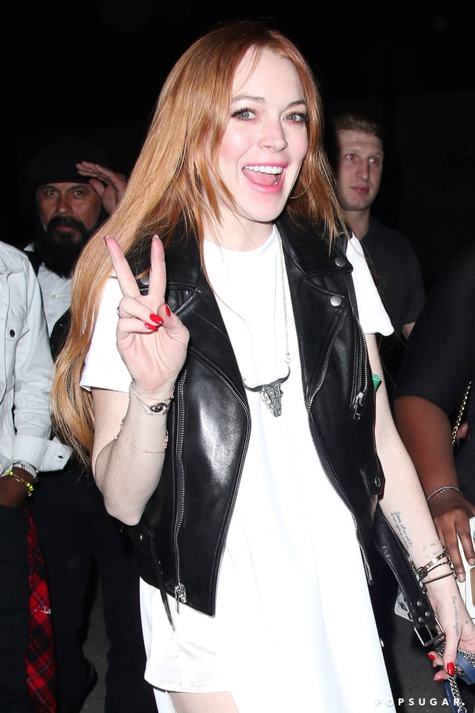 Lindsay Lohan was in a jovial mood, flashing a peace sign.