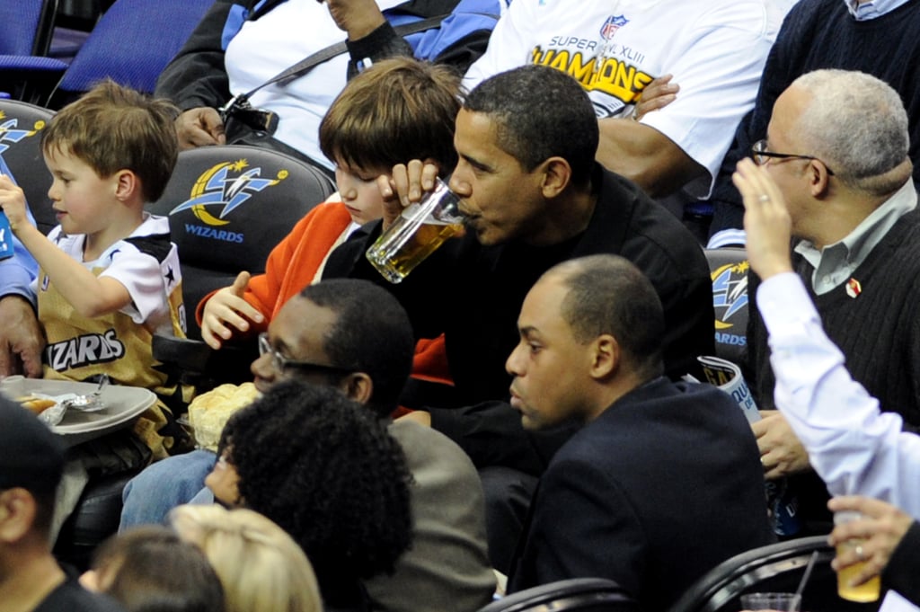 President Obama enjoyed a Chicago Bulls game with a beer in 2009.