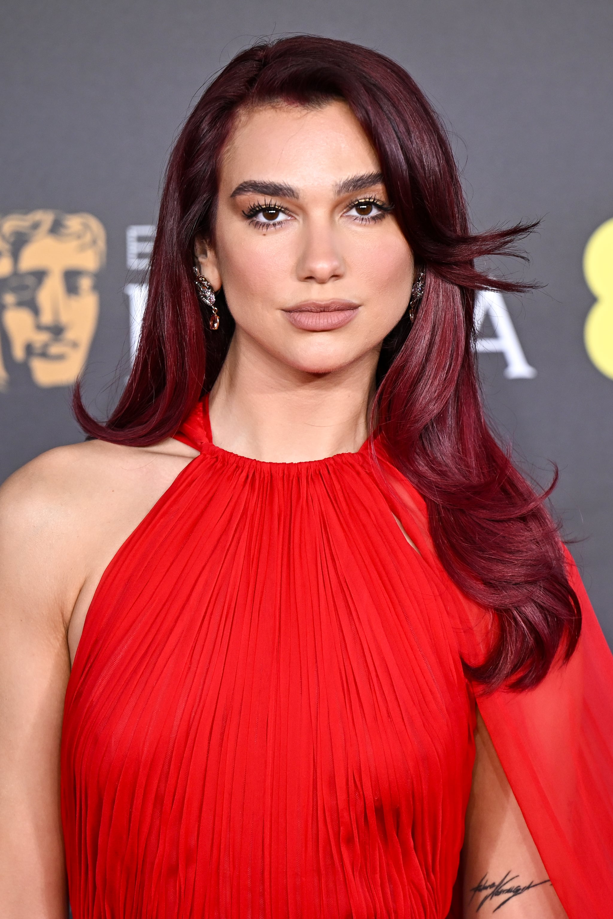 LONDON, ENGLAND - FEBRUARY 18: Dua Lipa attends the 2024 EE BAFTA Film Awards at The Royal Festival Hall on February 18, 2024 in London, England. (Photo by Stephane Cardinale - Corbis/Corbis via Getty Images)