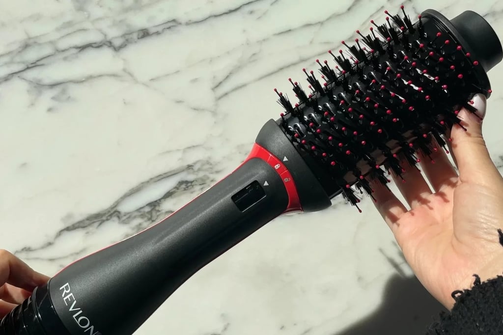 Revlon One Step Volumizer Hair Dryer and Hot Air Brush ($30, originally $60)
If you've been looking for a way to simplify your morning routine, look no further than this all-in-one beauty tool from Revlon. The hot air brush features blow-drying capabilities in a wand frame that'll help you achieve a salon-like blowout at home. Right now, it's on sale in the red color for 50 percent off. Read our review of the Revlon One Step Volumizer Hair Dryer and Hot Air Brush.
Editor Quote: "While my hair sometimes felt dry when using the older version of this blow-dryer brush, my experience with the newer version was the opposite: it was smooth and shiny." — Renee Rodriguez, beauty staff writer and social producer