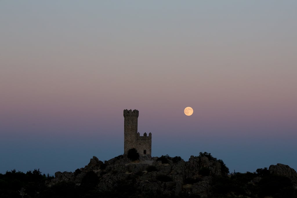 We spy the supermoon behind the Torrelodones Tower in city of Torrelodones, close to Madrid, Spain, on Aug. 10.