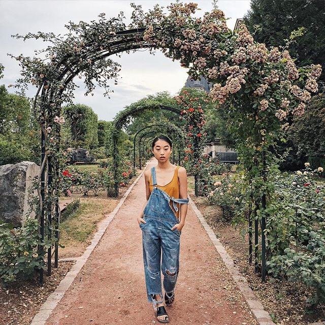 Wear it under a pair of distressed denim overalls.