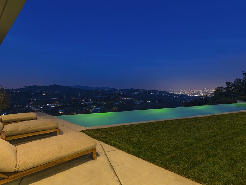 The infinity pool looks almost magical at night.