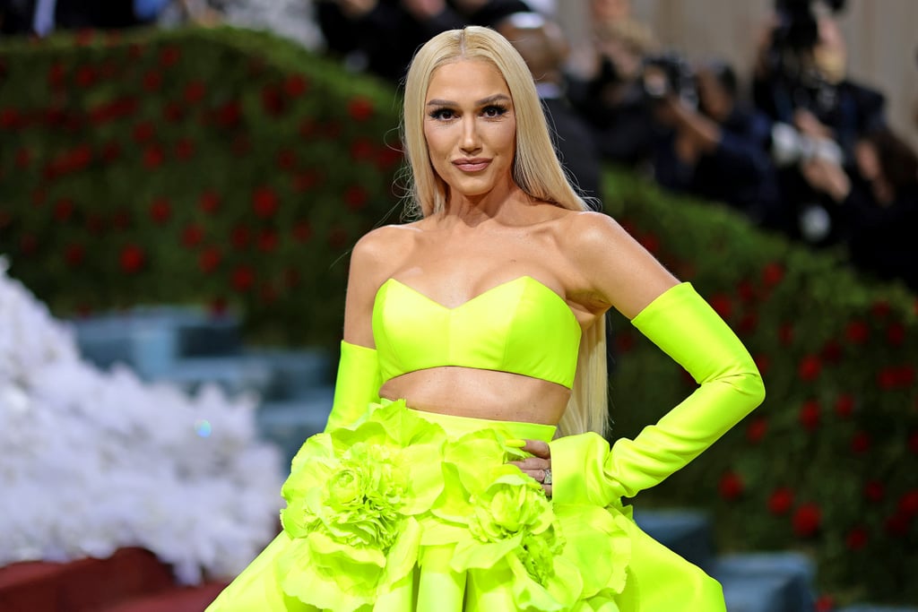 Gwen Stefani is a woman of many talents. As she arrived at the 2022 Met Gala on Monday evening, the singer and founder of the recently launched GXVE Beauty revealed she did her own makeup for fashion's biggest night. Complementing her neon-green Vera Wang two-piece, Stefani went for her signature winged eyeliner in a bright blue, which she paired with a neutral lip.
While chatting with La La Anthony for Vogue's red carpet live stream, Stefani shared she had to take matters into her own hands when her new makeup artist had an emergency. "I had a lot of fun doing it today, and it was stressful too but in a good way," she said. "I was like, 'All right, I got this.'" 
Luckily, Stefani had her own makeup brand at her fingertips to achieve the look. For her glowy base, the singer applied the All Time Prime Clean Hydrating Prep & Smooth Face Oil ($48), followed by the Hella On Point Ultra Fine Eyebrow Pencil ($24) for her natural brows. The vibrant blue wings were courtesy of the Line It Up 24-Hr Waterproof Gel Liner ($21) in Bathwater. Finally, Stefani mixed different GXVE lipstick shades to create her soft nude lip using products that have yet to launch. Take a closer look at her impressive work ahead.

    Related:

            
            
                                    
                            

            Lizzo Says She&apos;s "Opening Everybody&apos;s Wine" With Her Met Gala Mani