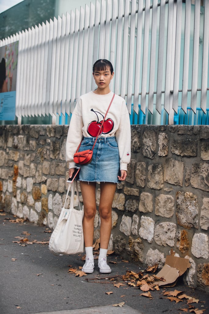 A fruit-print top is so playful with a denim skirt.