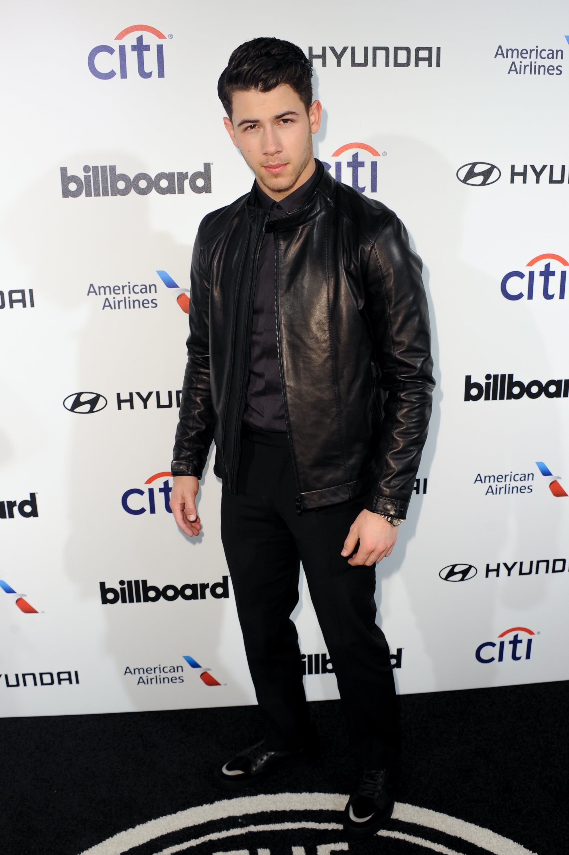 Nick Jonas wore a leather jacket to the 
