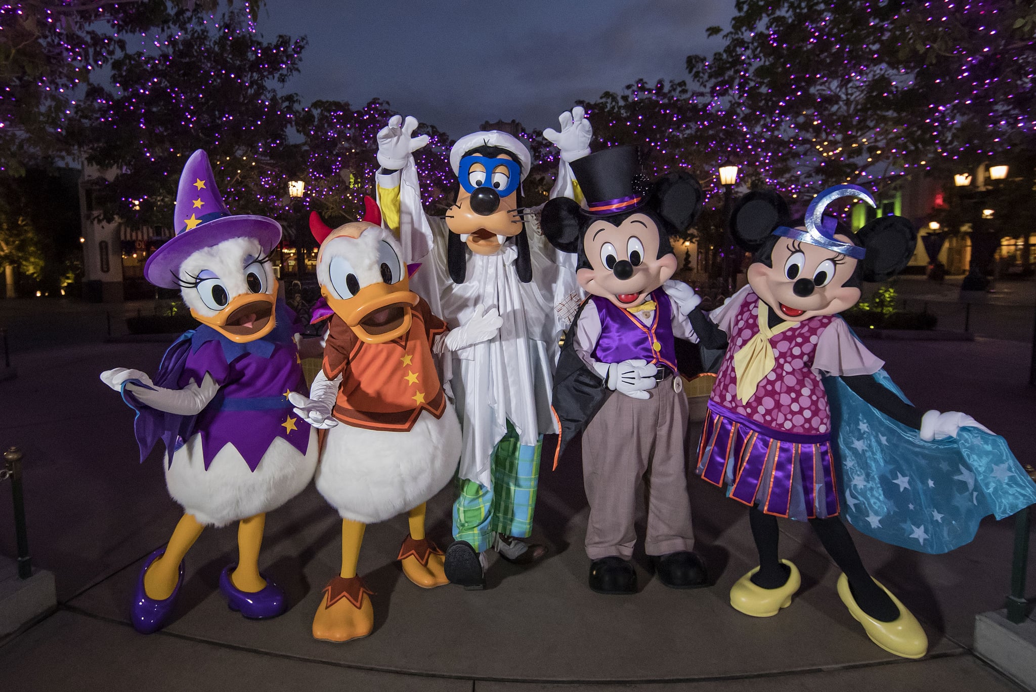 HALLOWEEN TIME CHARACTERS (ANAHEIM, Calif.) - Along Buena Vista Street at Disney California Adventure park, guests will enjoy Halloween decorations in store windows and in Carthay Circle, theyll see a 10-foot-tall statue of the Headless Horseman, holding up his jack-o'-lantern head to the sky. Mickey and his friends also will be in the area, donning their period-appropriate Halloween costumes, such as a bat for Mickey Mouse, a ghost for Goofy and a witch for Daisy Duck - all in playful fun, of course. (Joshua Sudock/Disneyland)