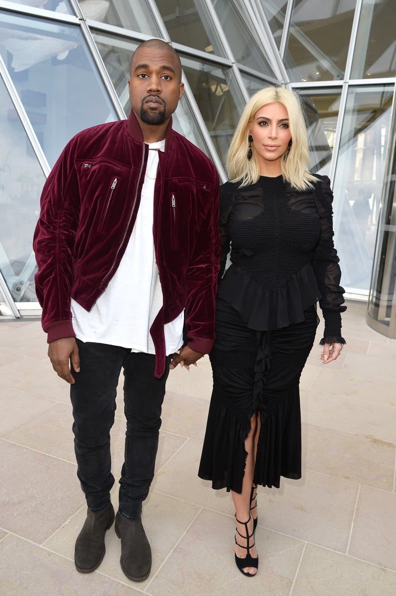 When they walked hand in hand to Louis Vuitton — Kim in couture and Kanye in his sweatshirt.