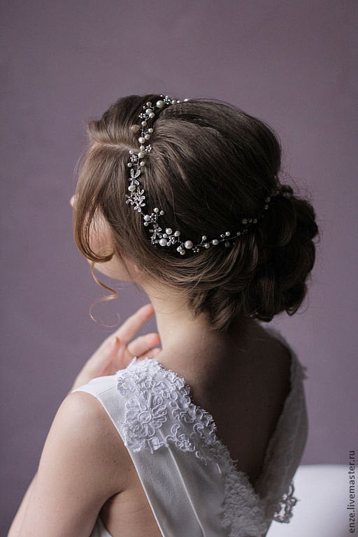 Ivory pearls and crystals make this headpiece ($70) look lovely from any angle.