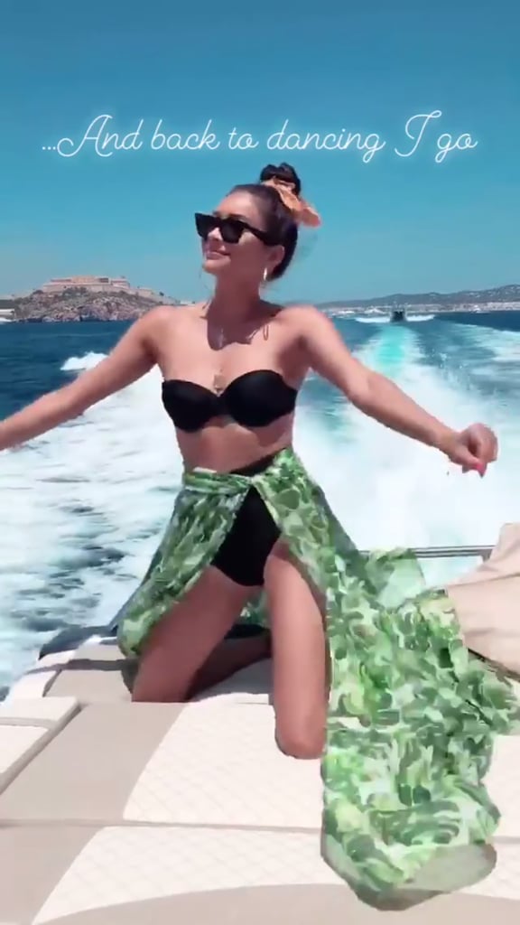 Shay Mitchell's back at it again, bringing her A-plus swimsuit game to the 'gram once more. The 31-year-old actress usually prefers sultry black one-pieces, but after some recent posts, she's making a serious case for the black high-waisted, strapless bikini. 
Shay shared snaps of a fantastic yacht getaway on her Instagram story, and thanks to her sexy swimsuit choice, she was able to lay in the sun and dance to her heart's desire. Find yourself a swimsuit that can fit all your needs, just like Shay's. Ahead, see even more photos from Shay's day on the water and decide if a black bikini will make its way into your wardrobe soon.
