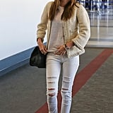 Miranda gave her bouclé jacket the cool-girl treatment when she paired it with some ripped white jeans.