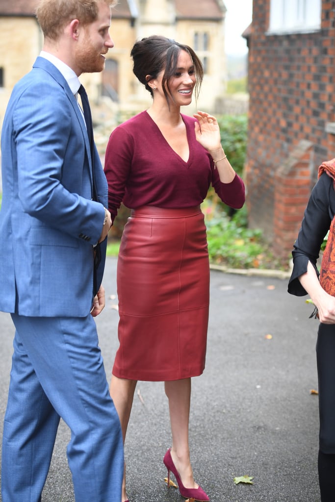 During an outing in late 2019, the duchess paired the same leather skirt by Boss, this time in a striking burgundy, with a matching v-neck sweater and suede heels for a full cranberry-colored look.