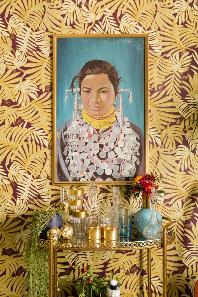 One of Justina's big pieces of advice for small-space holiday decorating is to jazz up what you have already. "We also use existing decor to make things look festive," she explained. Case in point: this bar cart, which feels merry and cheerful thanks to all the metallic gold pieces atop it.