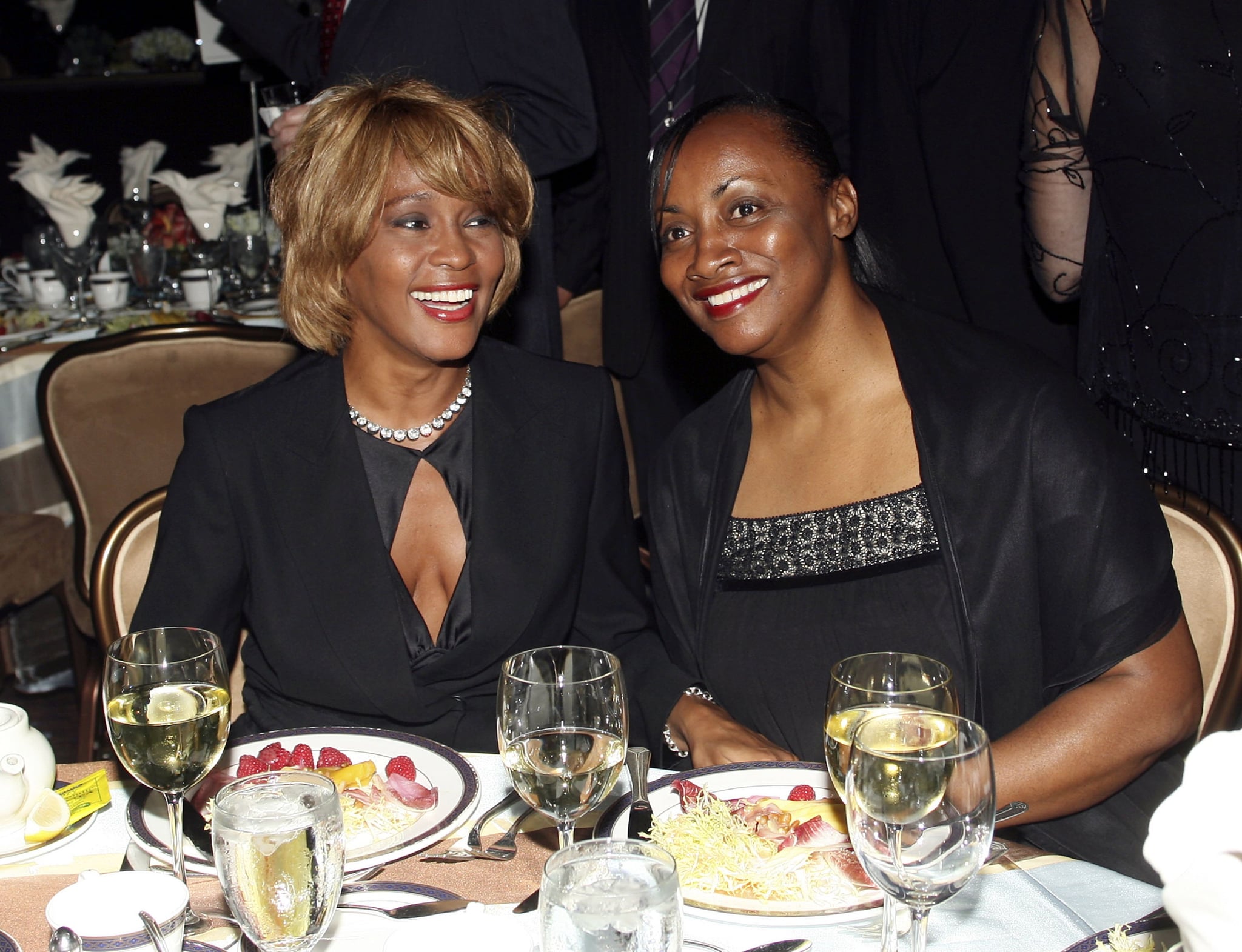 BEVERLY HILLS - SEPTEMBER 12: (L-R) Recording artist Whitney Houston and an unidentified guest attend the 15th Annual Ella Awards at the Beverly Hilton Hotel on September12, 2006 in Beverly Hills, California.  (Photo by Frederick M. Brown/GettyImages)