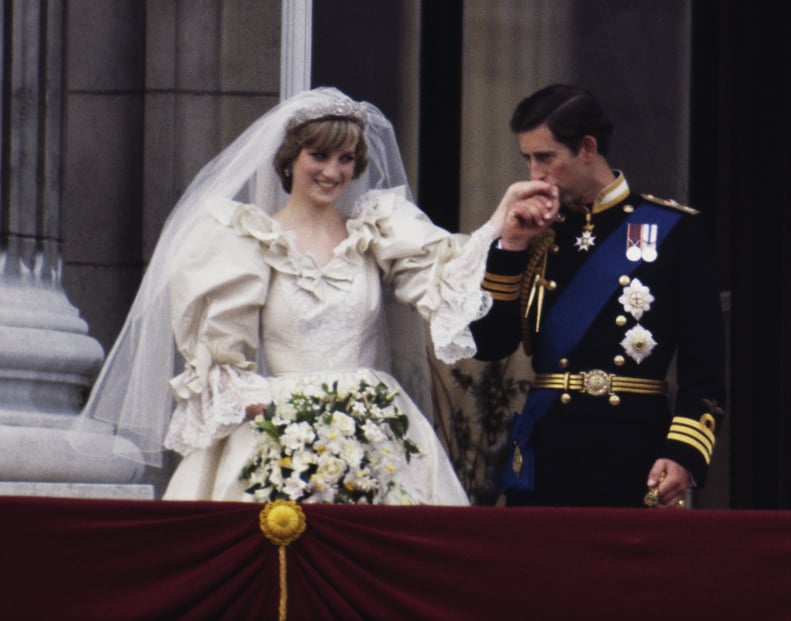 The Prince and Princess of Wales on the balcony of Buckingham Palace on their wedding day, 29th July 1981. She wears a wedding dress by David and Elizabeth Emmanuel and the Spencer family tiara. (Photo by Terry Fincher/Princess Diana Archive/Getty Images)