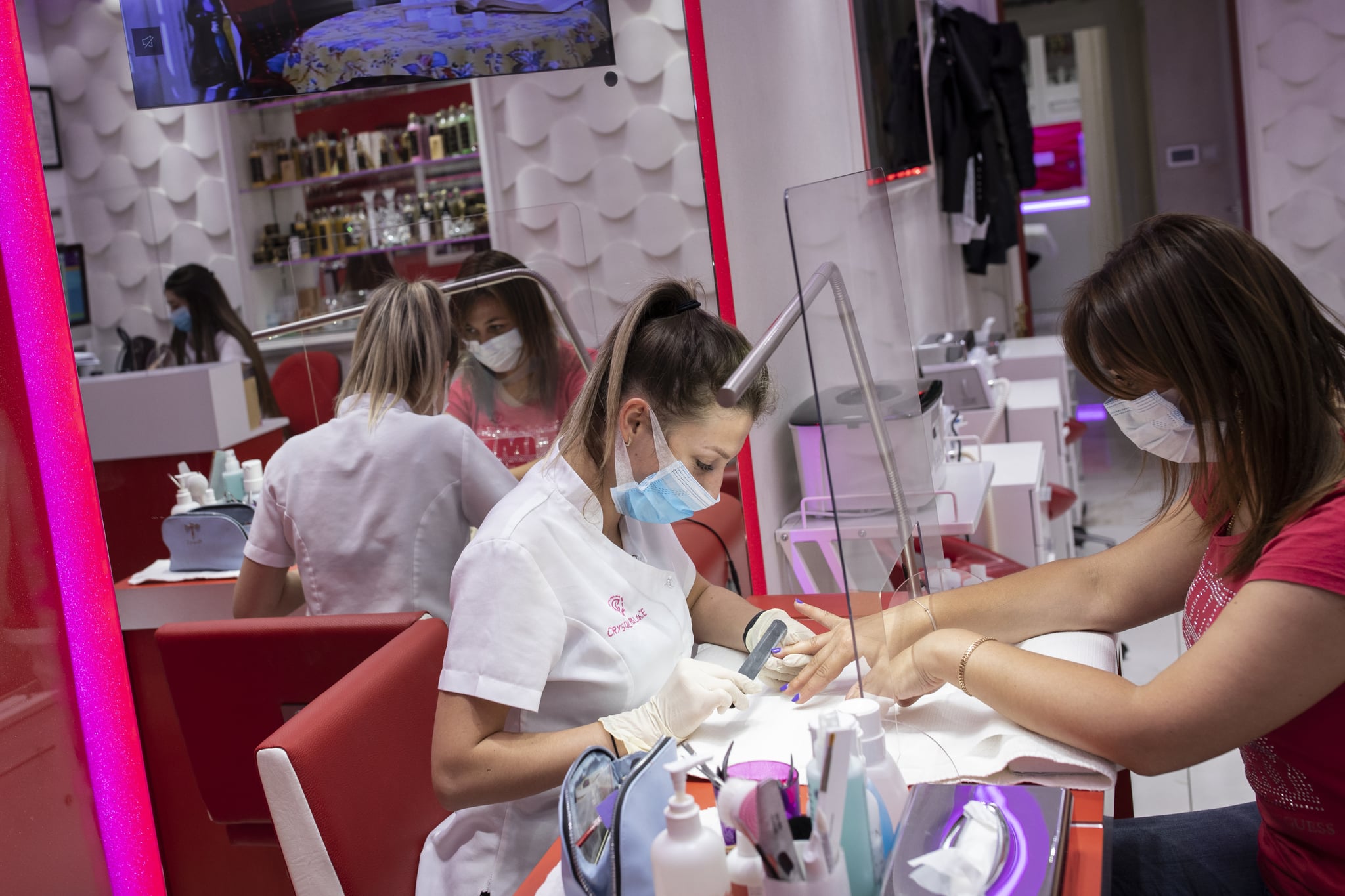 LONDON, ENGLAND - JULY 13: A customer has her nails done at the Crystal Palace Spa in Marylebone on July 13, 2020 in London, England. Nail salons, tattoo parlors and spas are among the businesses allowed to reopen today in England as the government eases the restrictions meant to curb the spread of Covid-19. (Photo by Dan Kitwood/Getty Images)