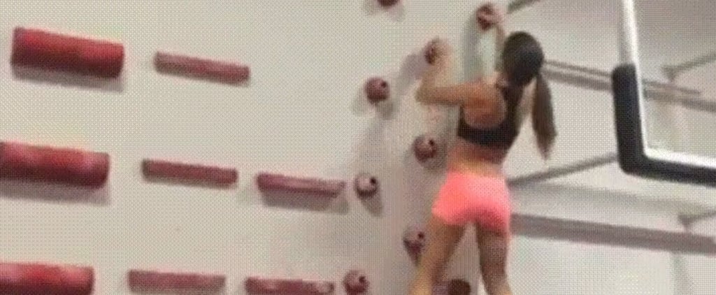 Female Rock Climber Using Campus Technique