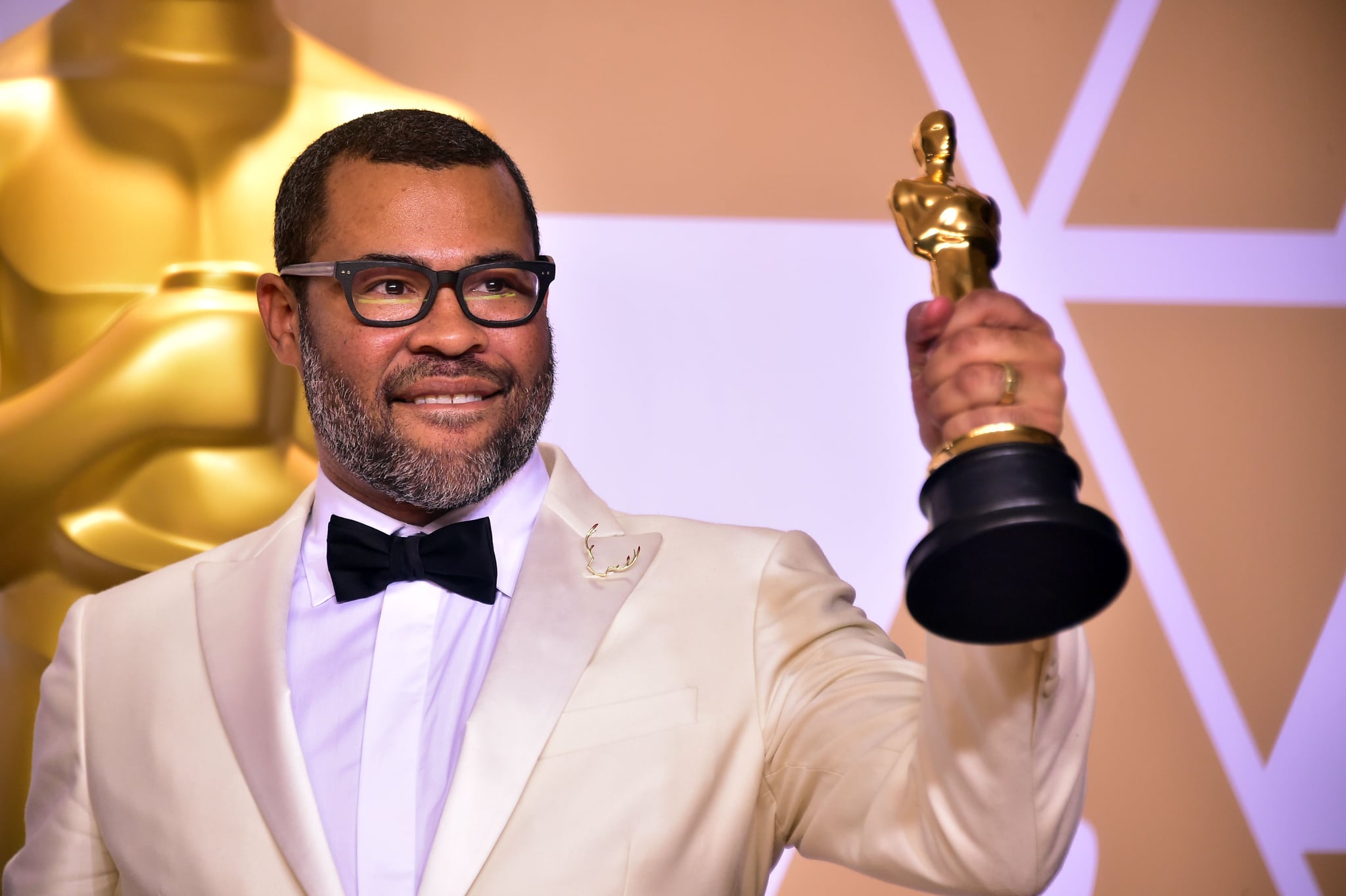 Director Jordan Peele poses in the press room with the Oscar for best original screenplay during the 90th Annual Academy Awards on March 4, 2018, in Hollywood, California.  / AFP PHOTO / FREDERIC J. BROWN        (Photo credit should read FREDERIC J. BROWN/AFP/Getty Images)