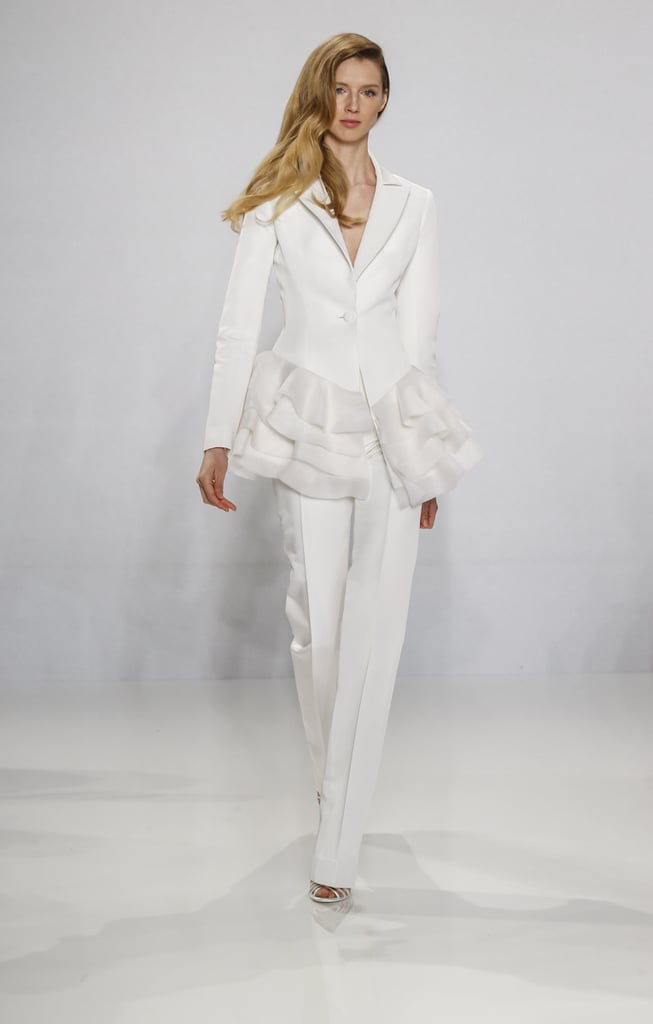 Tailored suit with cascading ruffles.