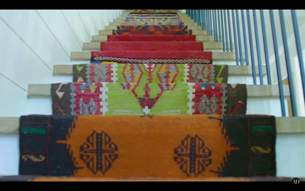 The runner on their stairs is stitched together from different rugs.