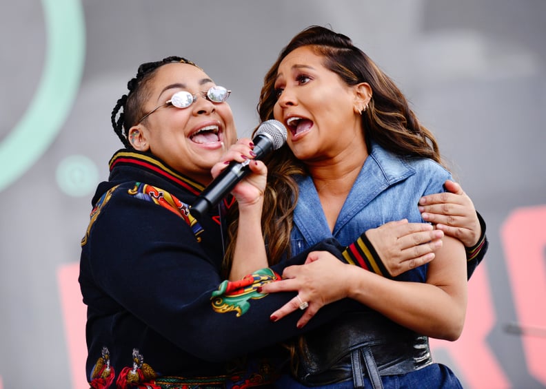 LOS ANGELES, CALIFORNIA - JANUARY 18:  Raven-Symoné and Adrienne Bailon are seen onstage at the 4th annual Women's March LA: Women Rising at Pershing Square on January 18, 2020 in Los Angeles, California. (Photo by Chelsea Guglielmino/Getty Images)