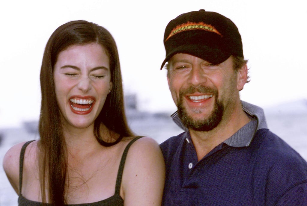 Liv Tyler cracked up while attending a photocall with her Armageddon costar Bruce Willis.