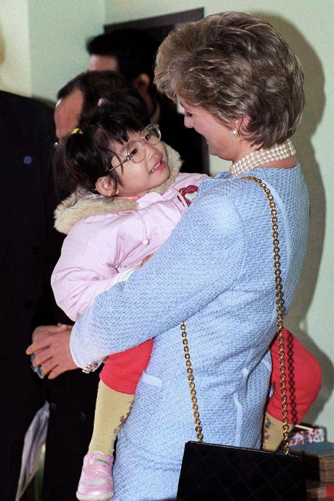 In February 1995, the Princess of Wales smiled at a young girl at the Umeda Akebone School in Tokyo, Japan.