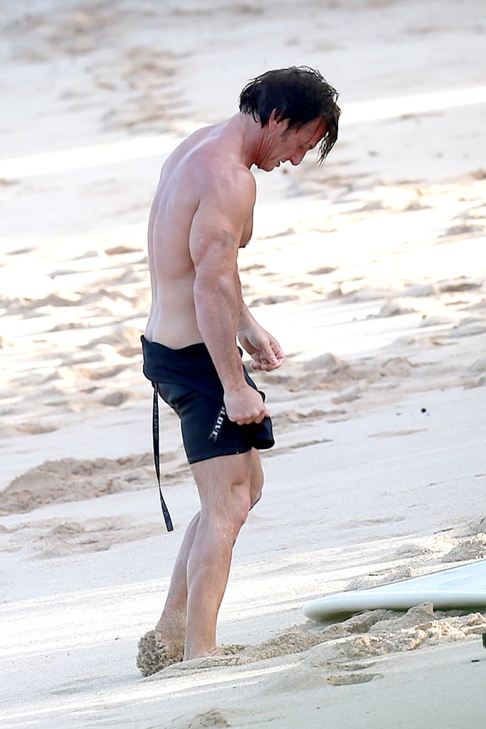 Sean showed off his shirtless body on the beach.