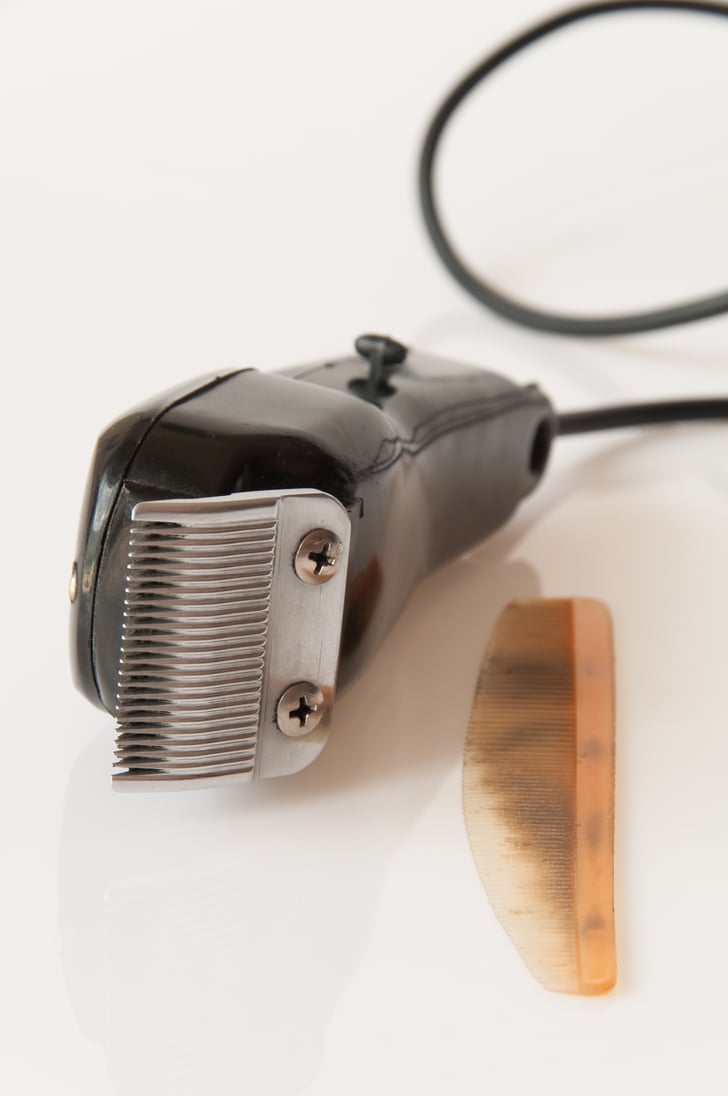 cutting women's hair with electric razor