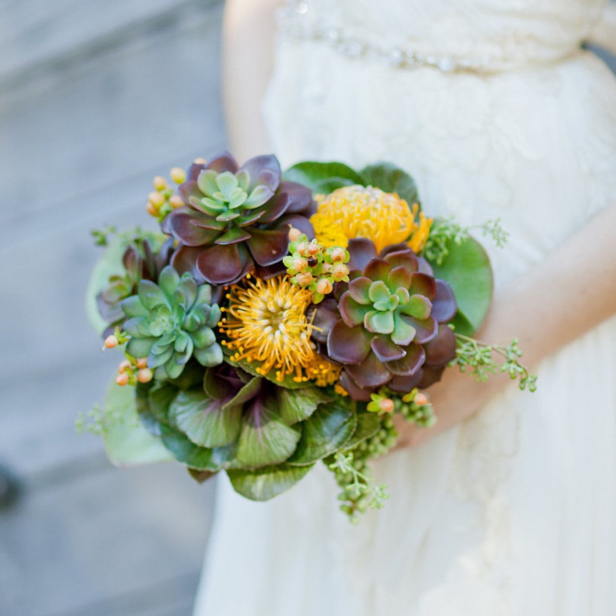 You don't have to be "alternative" or pinching pennies to want a nonfloral bouquet at your wedding. From feathers to ferns, there are so many chic options that are not only gorgeous, but also one of a kind. Check out all of these stunning, outside-the-box bouquet options from POPSUGAR Home. They're fit for both the bride and the bridal party.
Photo by  Andi Mans via Style Me Pretty