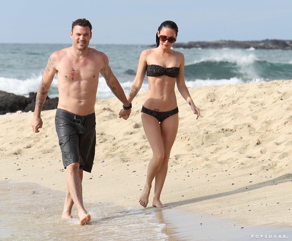 The couple held hands on the beach as they relaxed in Hawaii in June 2010.