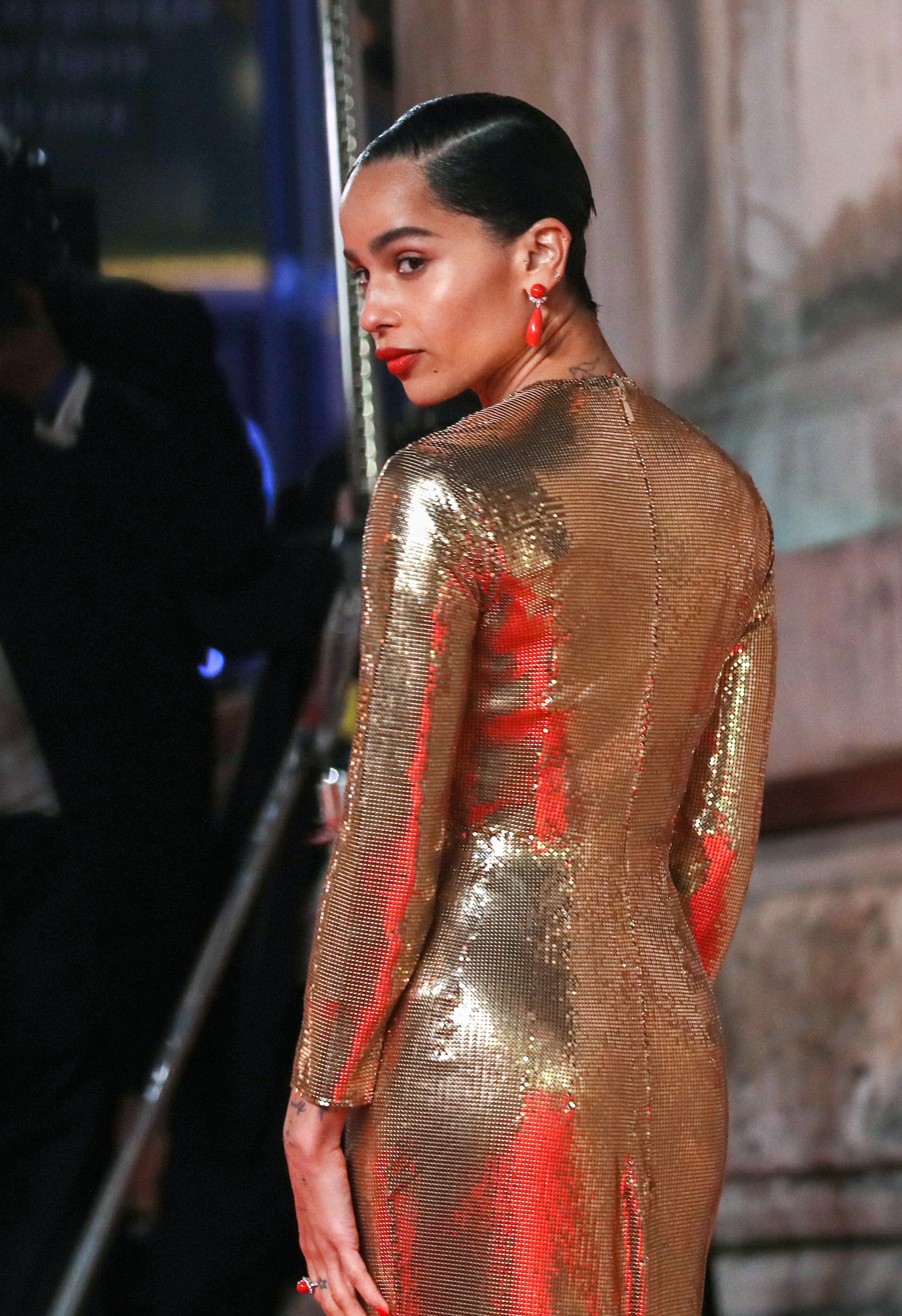 zoe kravitz gold dress Zo Kravitz Slips Into Saint Laurent for the Golden Globes 2026 Red Carpet
