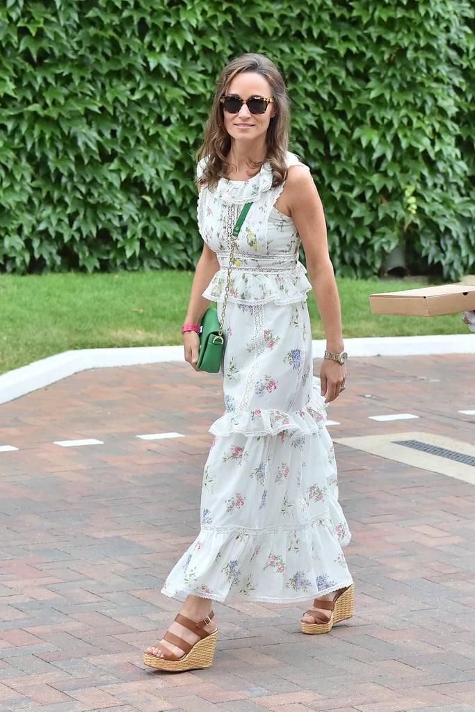 Wearing a Weekend Max Mara dress with a green Tory Burch bag and L.K. Bennett wedges at Wimbledon in 2017.