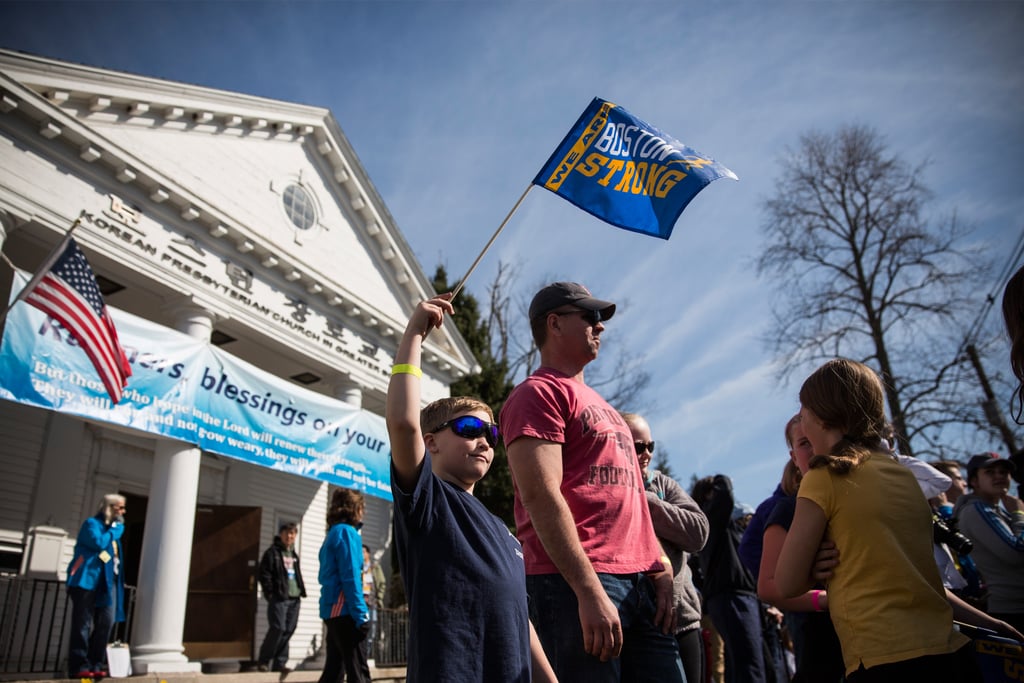 An 8-year-old boy waved a "Boston strong" flag.