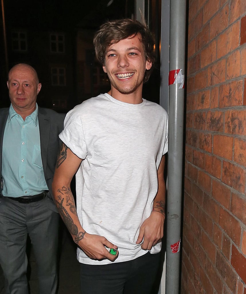 Louis Tomlinson headed out in London with a smile on Friday.