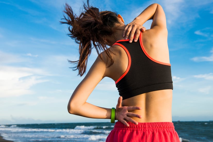 sport woman feel pain on neck and shoulder