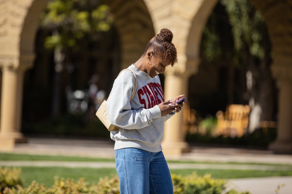 Issa topped wide-leg denim with a Stanford sweatshirt and a Telfar bag.
