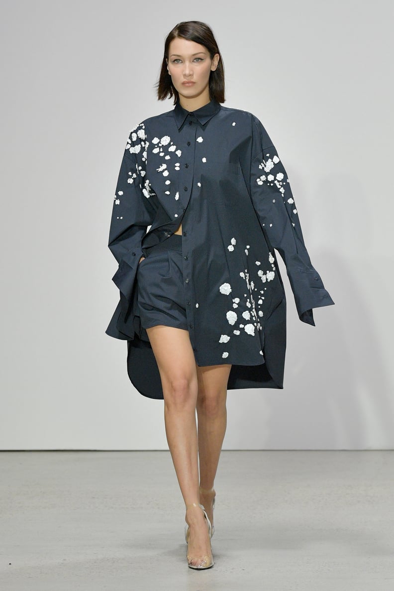 Bella Walked the Oscar de la Renta Runway in a Roomy Floral Button-Down, Shorts, and PVC Heels