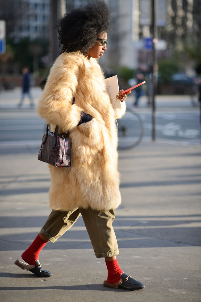 Just add a pair of bright socks to slides, then cover up accordingly with a chic coat à la Julia Sarr Jamois.