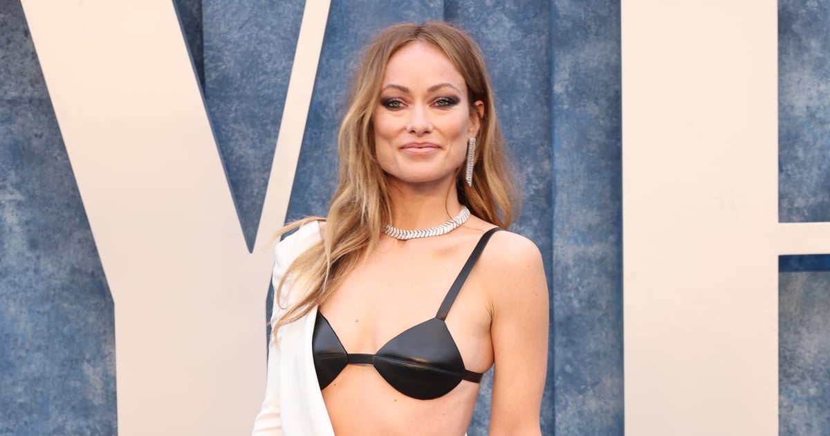 Olivia Wilde spices up her simple outfit by wearing a black bra under her  sheer white T-shirt