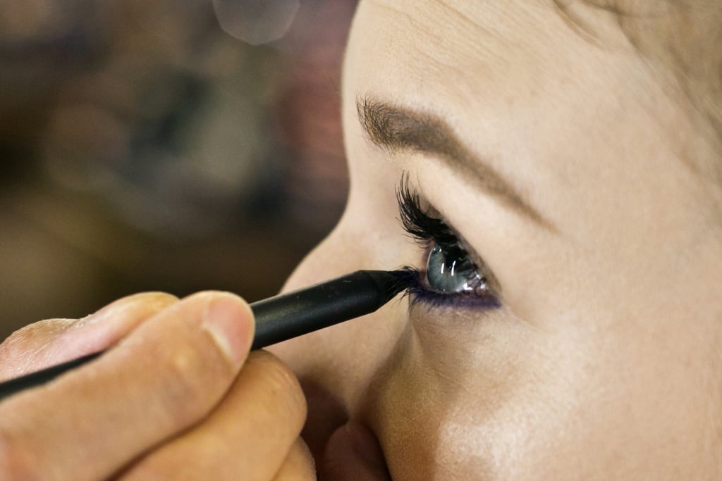 To create a plum smoky eye, waterline of the bottom lashes at the root and just under the lashes with a deep violet liner — Jennings used MAC Pro's Longwear Eyeliner in Snow Shadow ($20). "You want it to show up and be smoky," Jennings says. "Make sure there are no spaces or gaps so you don't see any light spots on the eye."