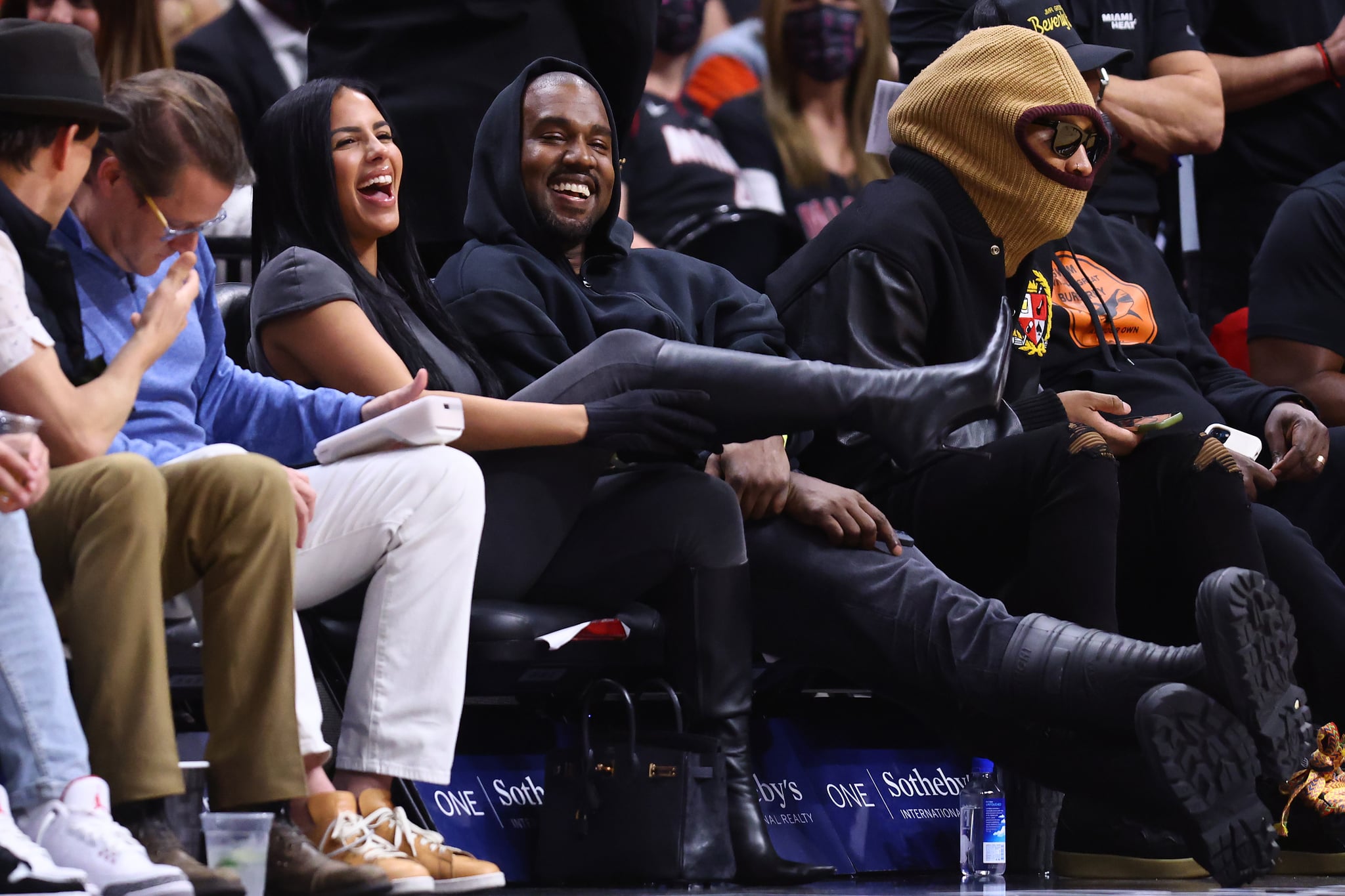 MIAMI, FLORIDA - MARCH 12: Rapper Kanye West and girlfriend Chaney Jones attend a game between the Miami Heat and the Minnesota Timberwolves at FTX Arena on March 12, 2022 in Miami, Florida. NOTE TO USER: User expressly acknowledges and agrees that, by downloading and or using this photograph, User is consenting to the terms and conditions of the Getty Images License Agreement. (Photo by Michael Reaves/Getty Images)