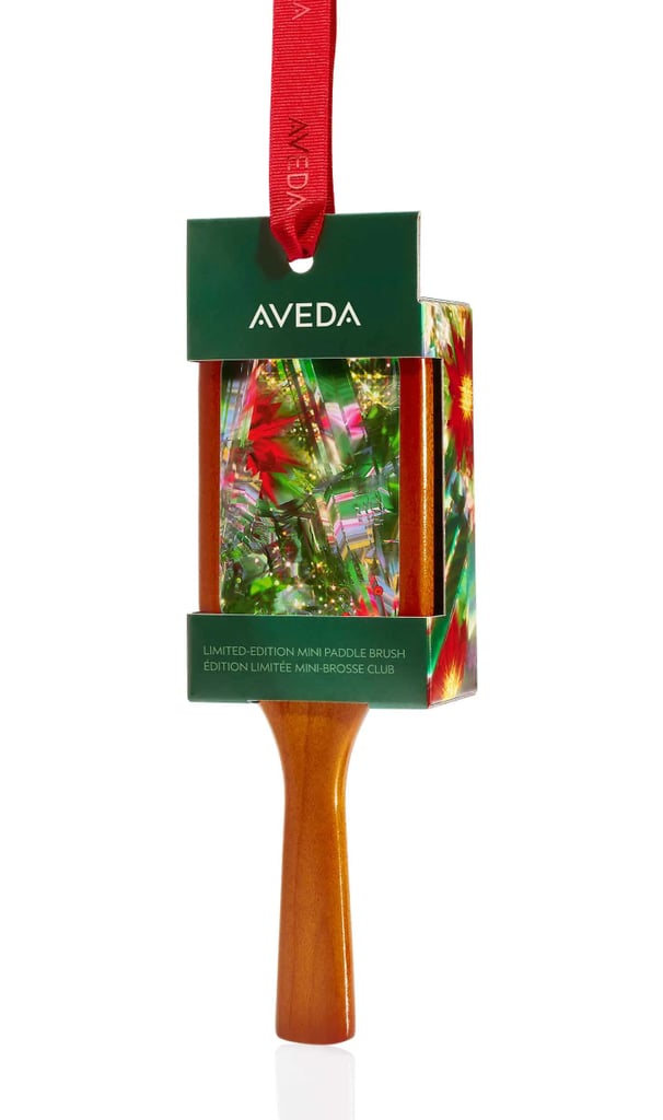 Aveda Limited-Edition Mini Paddle Brush Ornament ($28)
If you're gifting a hairbrush this season, this is the one to grab. The mini version doubles as a holiday ornament, and it's a scaled-down take on the brand's bestselling brush that smooths, detangles, and slips easily into a handbag.
FYI: The full-size Aveda Wooden Paddle Brush  ($34) is just as reliable, and a longtime Aveda favorite.