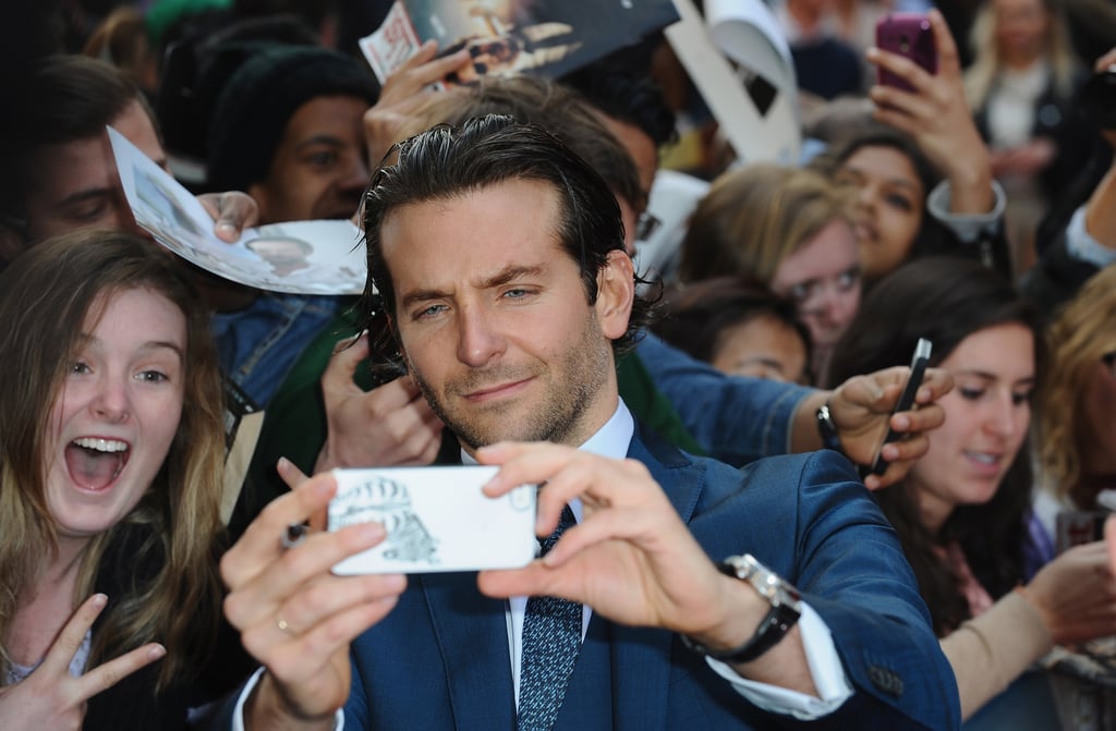 Bradley Cooper snapped a shot of himself with fans at the London premiere of The Hangover Part III in May 2013.